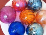 Blown-glass ornaments in a range of beautiful colors, from a husband and wife team in San Francisco. Lots of other pretty items in this store too! $25 each.Click here to purchase